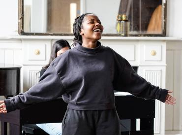 A student singing in a classroom